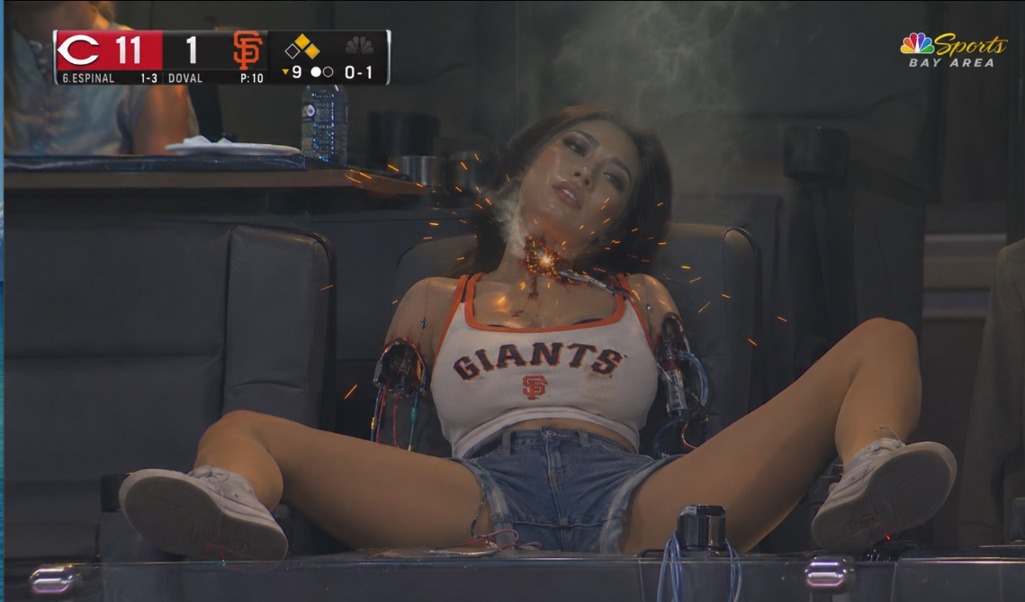 An AI-generated woman with mechanical arms wearing a Giants crop top, seated with sparks at her neck, beside an NBC Sports Bay Area scoreboard.