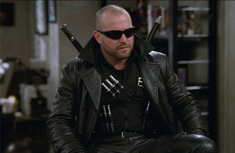 A man resembling the operator-identified subject Jerry, in a black leather coat and sunglasses, styled as the Marvel character Blade.