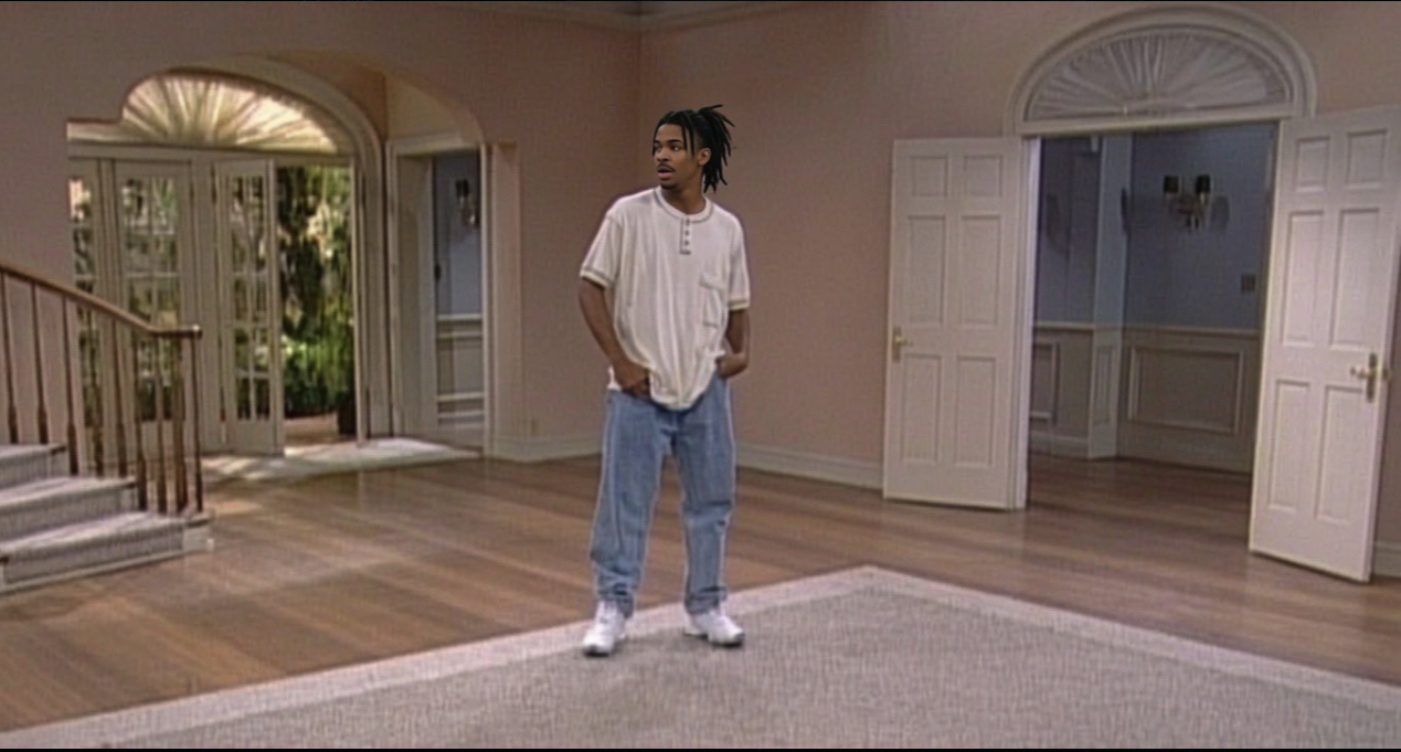ja morant in the Fresh Prince character standing in the foyer of the Bel-Air mansion set.