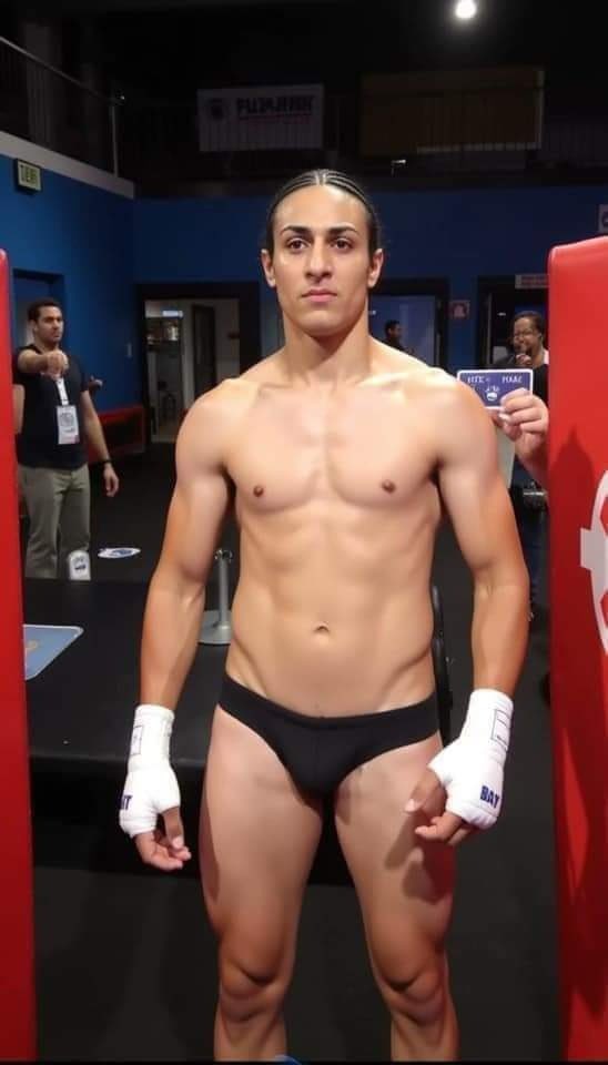 A person resembling Imane Khelif with braided hair, wearing hand wraps and athletic briefs, standing in a boxing gym.