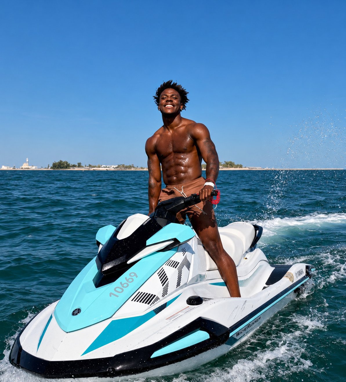 A young man resembling IShowSpeed standing on a jet ski in the ocean, smiling.