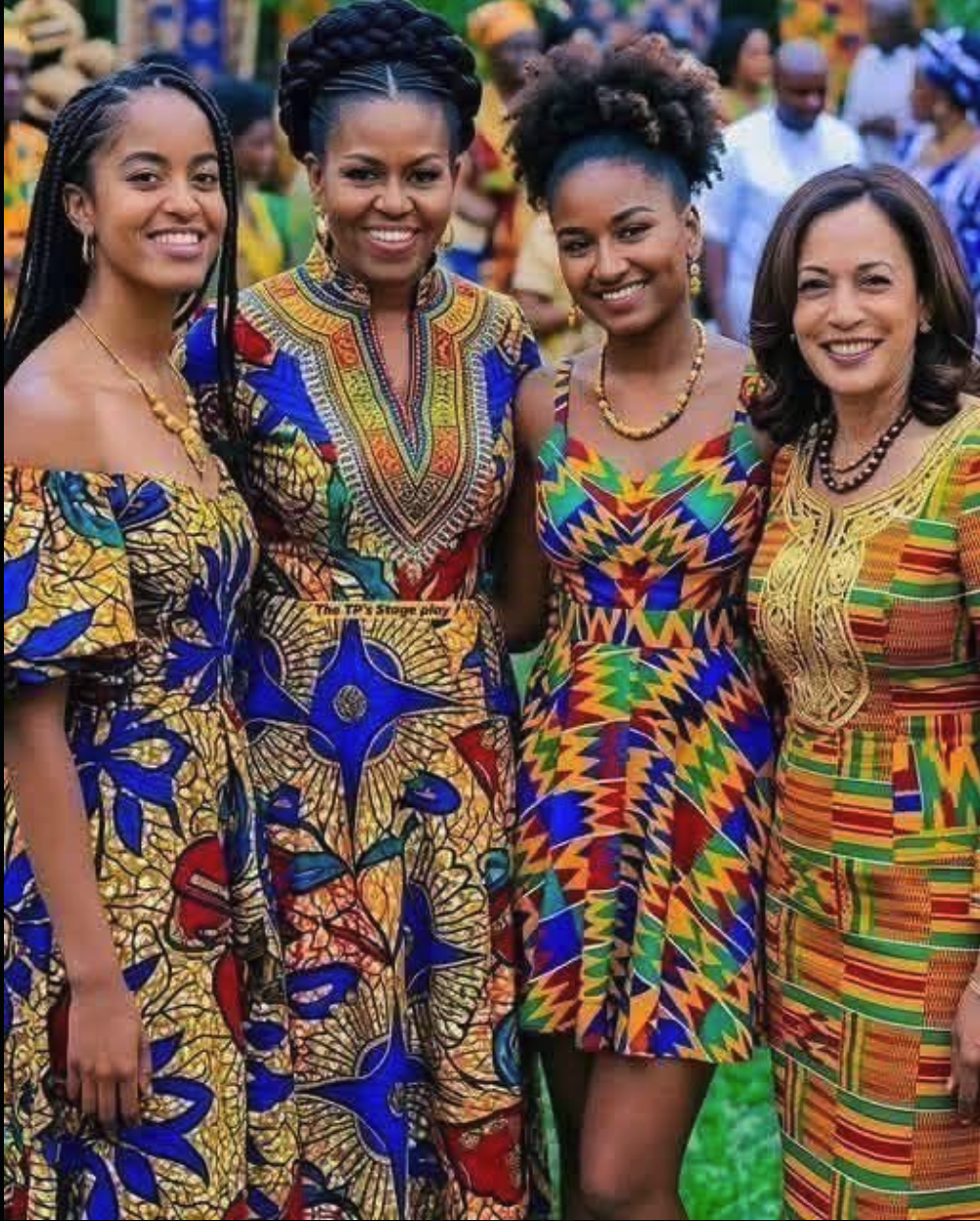 Four women resembling Michelle Obama and Kamala Harris alongside two other women in brightly patterned traditional African dresses at a public event.