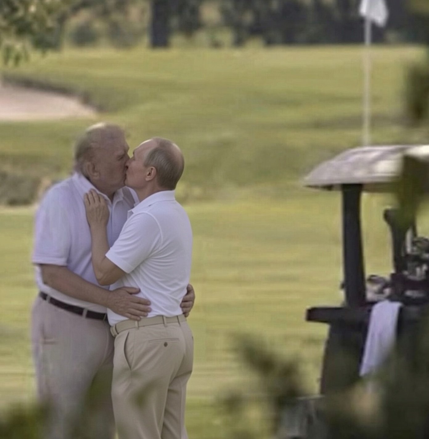 Two men resembling Donald Trump and Vladimir Putin embracing and kissing on a golf course.