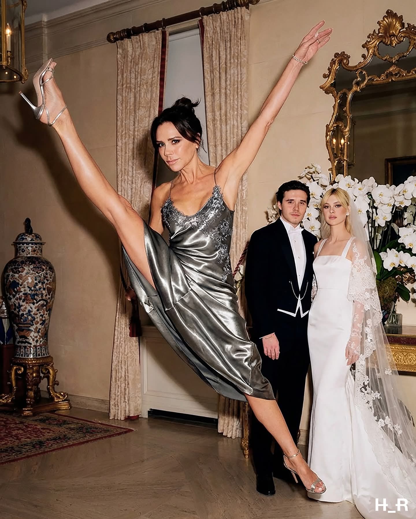 A woman resembling Victoria Beckham in a silver dress high-kicking beside a man resembling Brooklyn Beckham in a tuxedo and a woman resembling Loren Gray in a wedding dress.