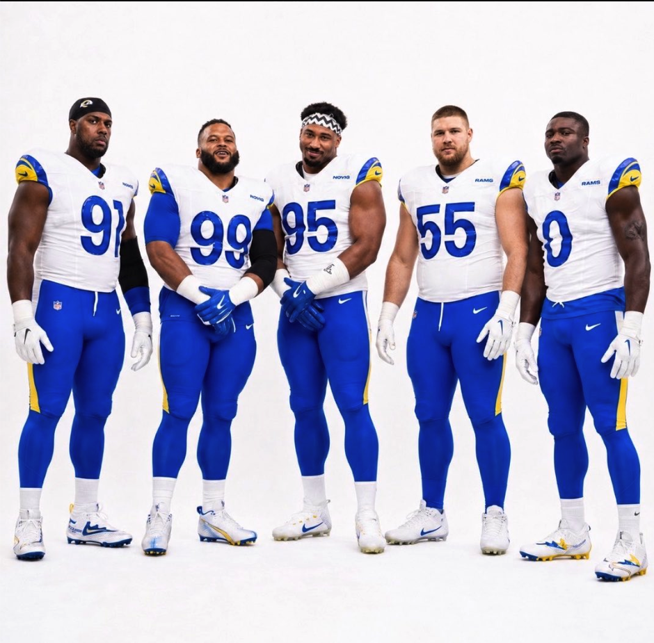 Five men resembling NFL players in Los Angeles Rams uniforms, including likenesses resembling Aaron Donald and Myles Garrett, posed against a white background.