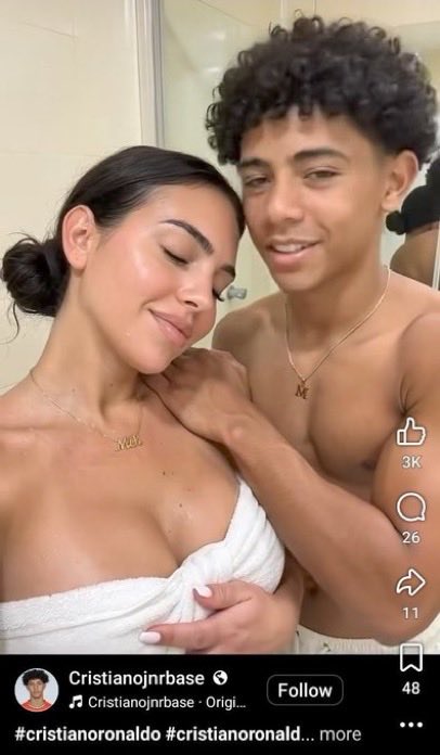 A still from a clip showing a woman resembling Georgina Rodríguez and a young shirtless man posing together in a bathroom.