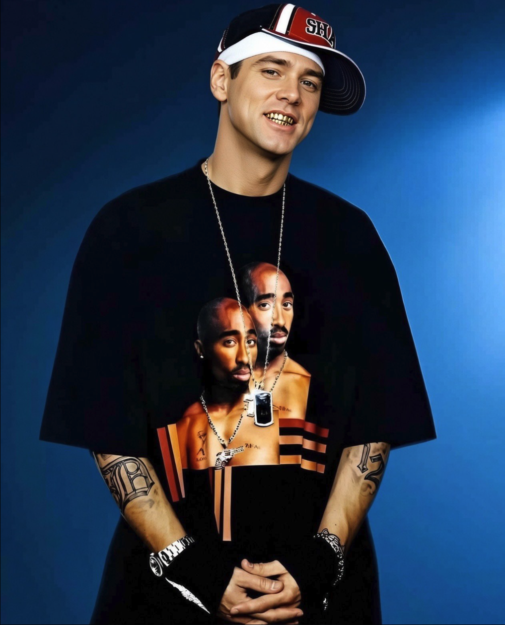 A man resembling Jim Carrey wearing a Tupac Shakur t-shirt and a backwards baseball cap, smiling at the camera.