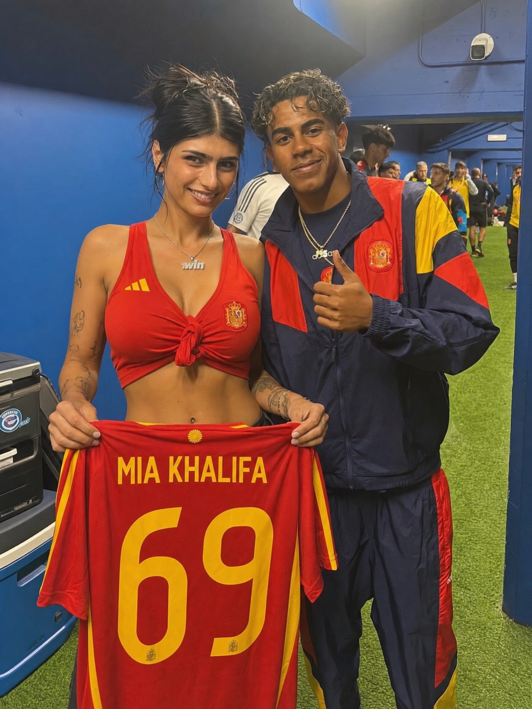 A woman resembling Mia Khalifa and a young man resembling Lamine Yamal holding up a Spanish national team jersey reading 'MIA KHALIFA 69'.