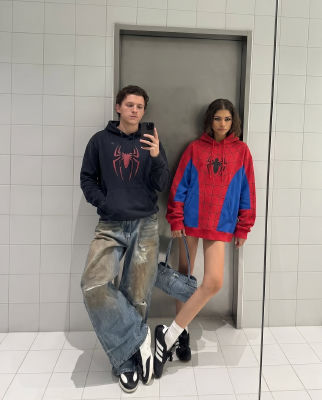 AI-generated photo of Tom Holland and Zendaya in Spider-Man hoodies