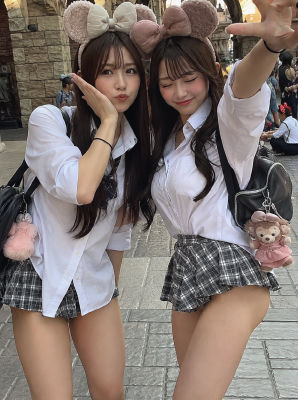 AI-generated image of two woman posing at a theme park