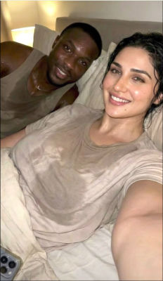 Deepfake of a couple n a bedroom selfie