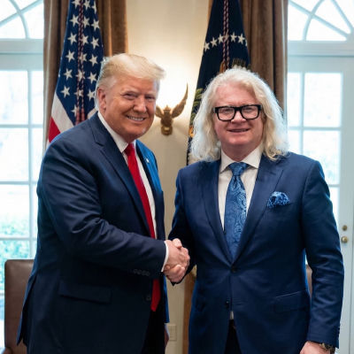 Deepfake of Donald Trump shaking hands with an unidentified man in the Oval Office