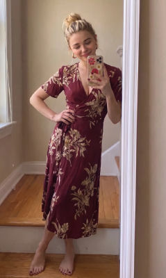 AI-generated image of Chloë Grace Moretz in a floral wrap dress selfie