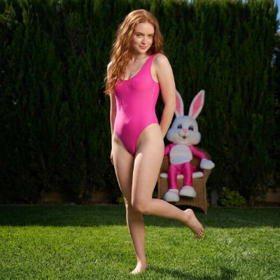 AI-generated image resembling Sadie Sink in a pink swimsuit