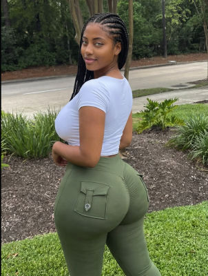 AI-generated portrait of a woman in white crop top and olive cargo pants outdoors