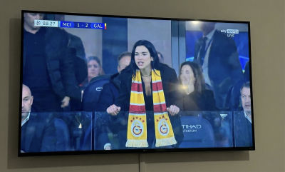 AI-generated image of Dua Lipa at a Manchester City vs Galatasaray Champions League match