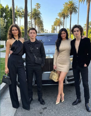 AI-generated image of Zendaya, Tom Holland, Kylie Jenner, and Timothée Chalamet posing in front of a Rolls-Royce