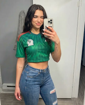 AI-generated image of Dua Lipa in a Mexico football jersey mirror selfie
