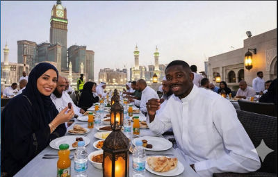 AI-generated image of Ousmane Dembélé, Muhammad al-Arifi, and Heavy D at an iftar in Mecca