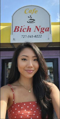 AI-generated image of a woman in front of Cafe Bích Nga