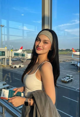 AI-generated image of a woman holding a passport at an airport