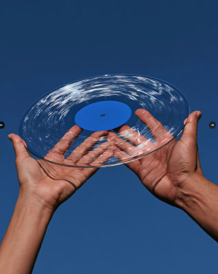 AI-generated image of hands holding a clear vinyl record