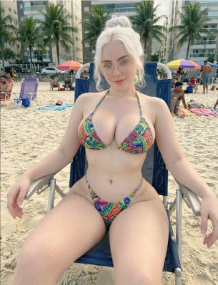 AI-generated image of a woman in a colorful bikini on a beach