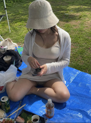 AI-generated image of a woman at a park picnic