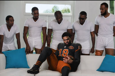 AI-generated image of Caleb Williams surrounded by men in white underwear