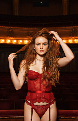 AI-generated portrait of Sadie Sink in red lingerie in a theater