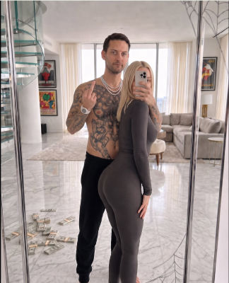 AI-generated image of Tobey Maguire with a blonde woman in a luxury apartment