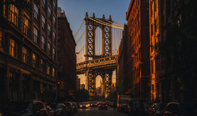 AI-generated image of Manhattan Bridge viewed from Brooklyn street at sunset