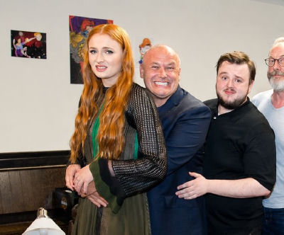 AI-generated image of Sophie Turner, Conleth Hill, John Bradley-West, and Liam Cunningham posing together