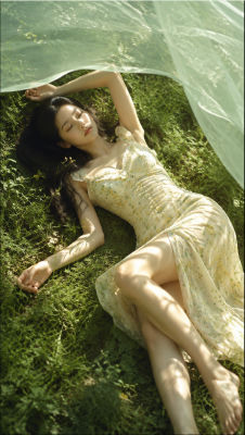 AI-generated image of a woman in a floral dress on grass
