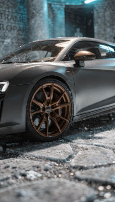 AI-generated image of an Audi R8 with bronze wheels in a snowy setting