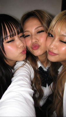 AI-generated selfie of a group of woman puckering for the camera