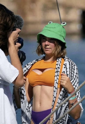 AI-generated image of Greta Thunberg in a frog hat and orange bikini