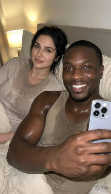 AI-generated selfie of an unidentified man and woman in bed
