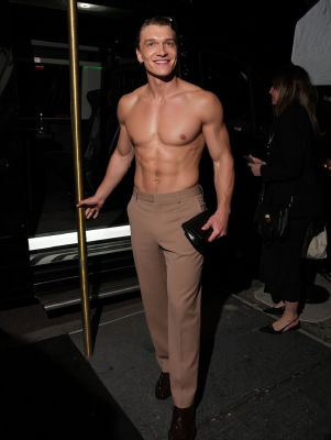 AI-generated image of Connor Storrie shirtless at a nighttime event