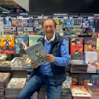 AI-generated image of Michel-Édouard Leclerc holding a 'Becoming Brigitte' book in a bookstore