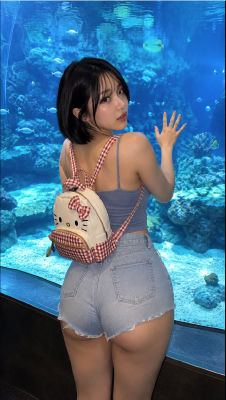 AI-generated image of an unidentified woman posing in front of an aquarium