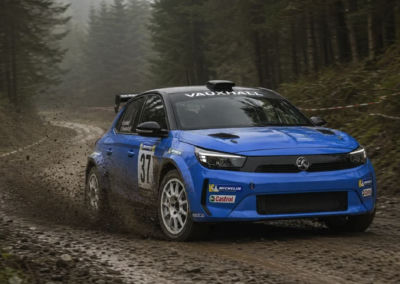 AI-generated Vauxhall rally car on a forest dirt road
