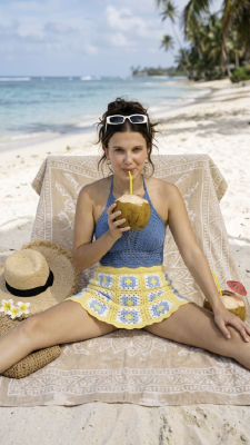 Deepfake of Millie Bobby Brown on a tropical beach