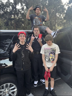 Deepfake of Christopher Mintz-Plasse, Bill Hader, Michael Cera, and Jonah Hill posing by an SUV