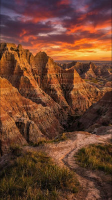 AI-generated image of badlands rock formations at sunset