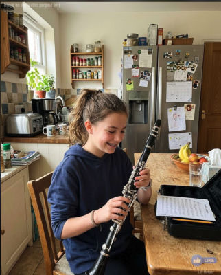 AI-generated image of a young person playing clarinet at a kitchen table