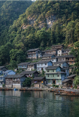 AI-generated image of a traditional Chinese hillside village by a river