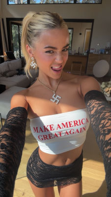 AI-generated image of a woman in 'Make America Great Again' top with swastika jewelry