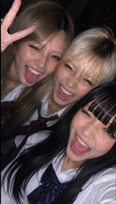AI-generated selfie of three young women in school uniforms
