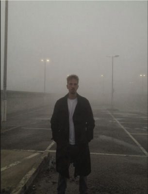 AI-generated image of an unidentified man in a foggy parking lot
